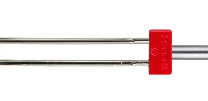 A twin sewing machine needle with a red Schmetz shank. This helps you decide what sewing machine needle to use for decorative stitches.