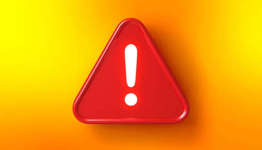 Rotes Warnschild mit Ausrufezeichen auf gelb-orangefarbenem Hintergrund. Achtung vor der Lichtblick Betrugsmasche!