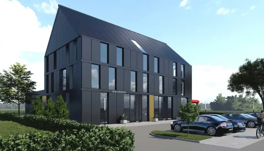 Nowoczesny projekt budynku mieszkalno usługowego z ciemną elewacją i dużymi oknami. Przed budynkiem parking z kilkoma samochodami.
