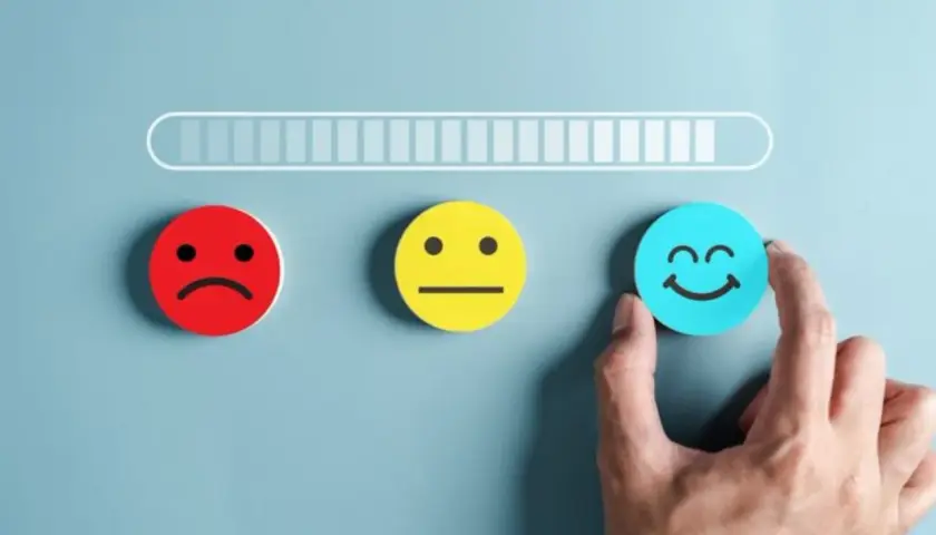 Progresso verso la felicità: un'icona sorridente, che simboleggia la dopamina, cos'è e come raggiungerla.
