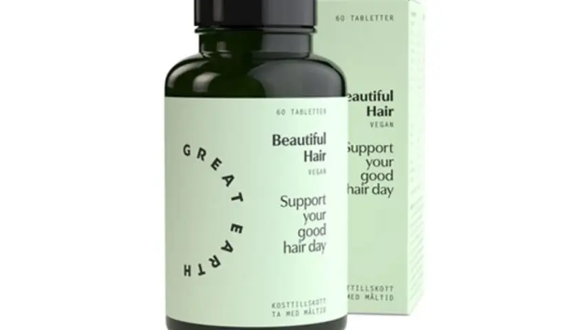 En flaska och en kartong med "Beautiful Hair" hår vitaminer. Stöd ditt goda hår-dag med dessa veganska kosttillskott.