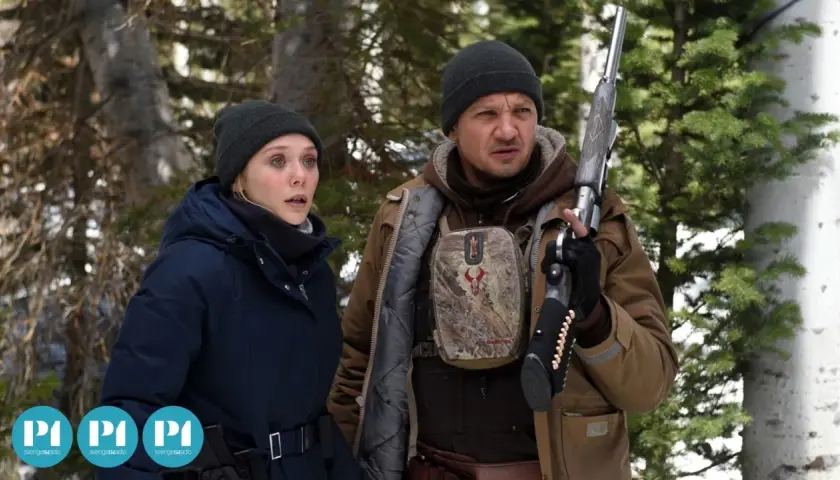 Elizabeth Olsen och Jeremy Renner i snöig skog. Rollistan i Wind River ser bekymrad ut.