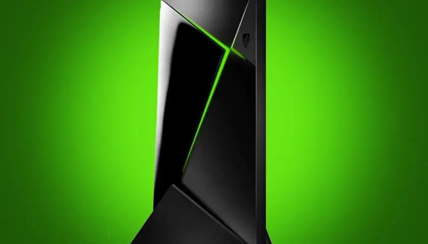 Elegancki, czarny Nvidia Shield Pro z zielonym podświetleniem, stojący na tle gradientu zieleni.