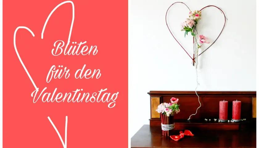Blumen für den Valentinstag: Ein Herz aus Zweigen mit Blüten hängt über einem Holzmöbel mit Kerzen und Blumen.