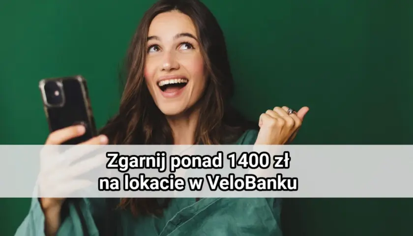 Uśmiechnięta kobieta trzyma telefon, a na ekranie widnieje napis "Zgarnij ponad 1400 zł na lokacie w VeloBanku".