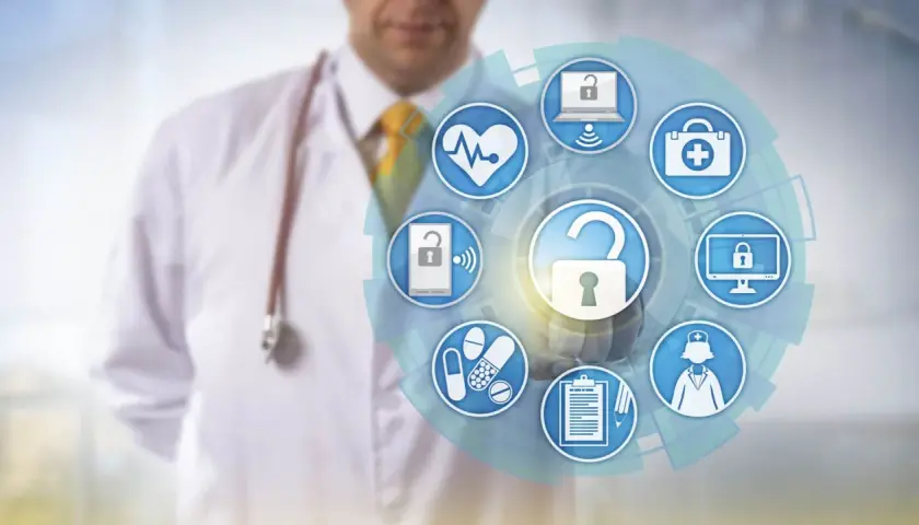 Medico con stetoscopio mostra un cerchio di icone mediche e di sicurezza, simboleggiando la **sicurezza informatica e privacy** nel settore sanitario.