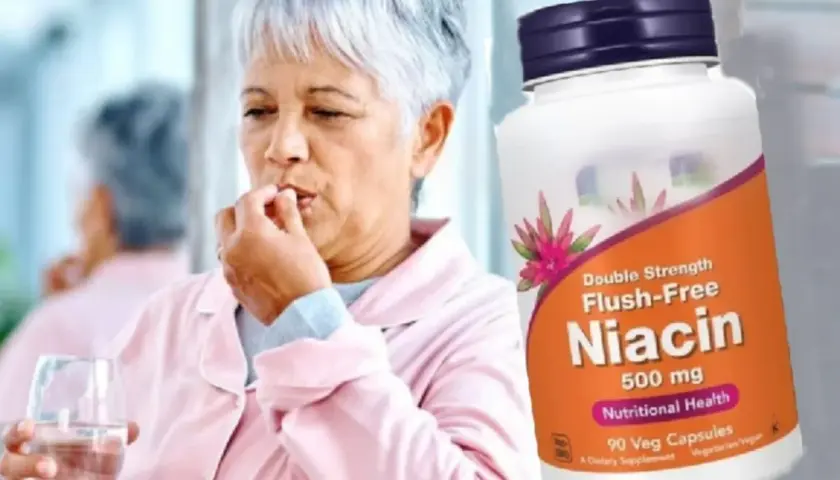 Mujer mayor toma una pastilla de niacina, que es vitamina B3 para que sirve en la salud.
