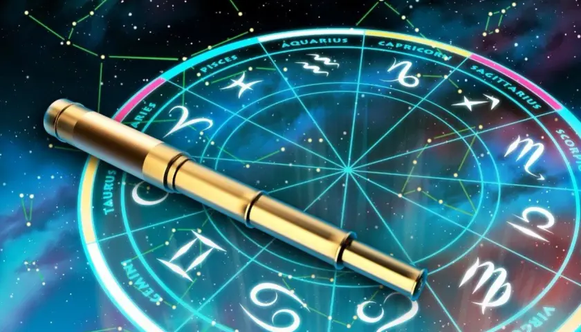 Złota luneta spoczywa na tle koła zodiaku, gdzie 23 sierpnia znak zodiaku to Panna.