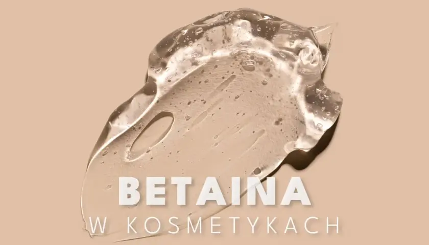 Przezroczysty żel z pęcherzykami powietrza, zawierający cocamidopropyl betaine, rozmazany na beżowym tle.