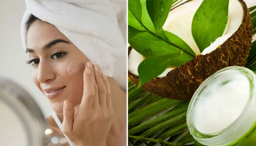 Mujer aplicándose crema en la cara junto a un coco y hojas verdes.