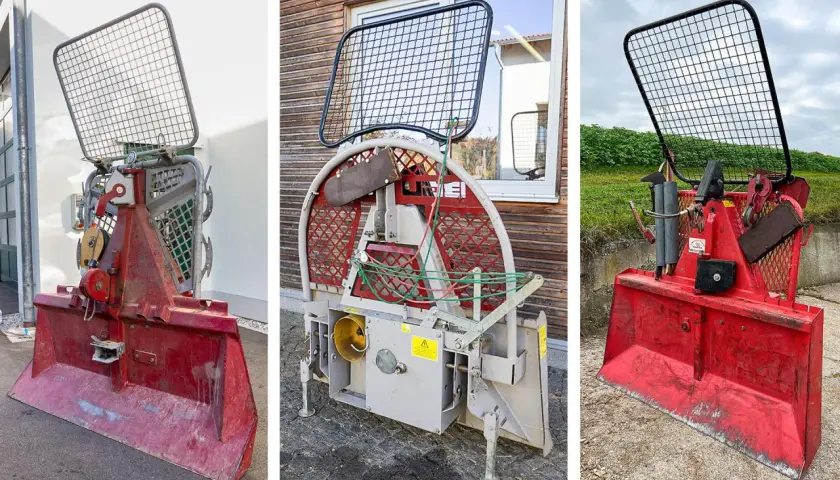 Drei rote Seilwinden mit Schutzgitter und Schaufel. Diese Kupplung Seilwinde ist robust und für schwere Arbeiten im Wald ausgelegt.