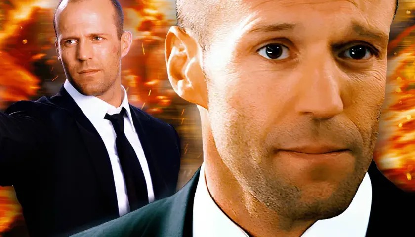 Jason Statham, który grał Transportera, w garniturze na tle wybuchów.