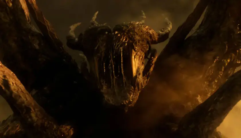 Le flagelleur mental de Stranger Things, une créature cauchemardesque aux cornes et aux tentacules, émerge des ténèbres.