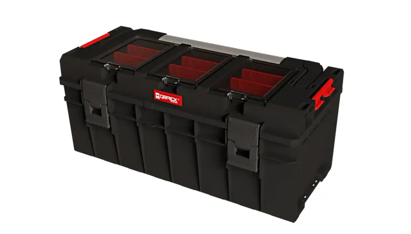 Czarna skrzynka narzędziowa Qbrick System Pro 600 z czerwonymi przegródkami i przezroczystą pokrywą.