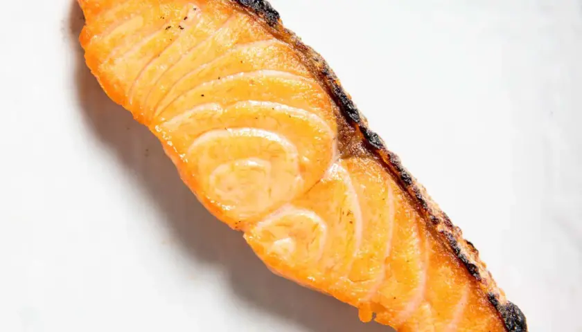 A perfectly cooked, flaky piece of salmon, ready for a delicious salted salmon recipe.