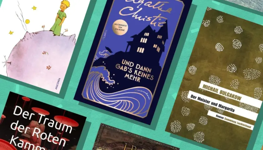 Bücherstapel mit "Der kleine Prinz", Agatha Christie und Bulgakows "Der Meister und Margarita" – eine Belletristik Top 10 Auswahl.