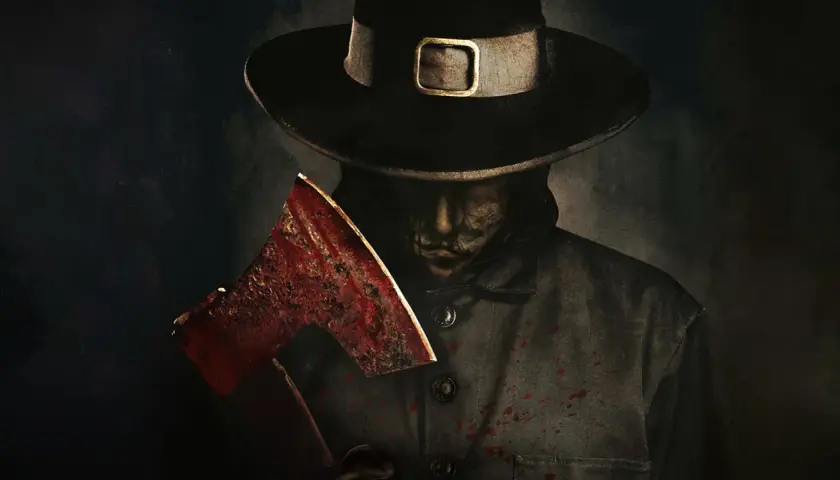 Un personaggio con cappello da pellegrino e ascia insanguinata, pronto per un macabro thanksgiving (film) recensioni.