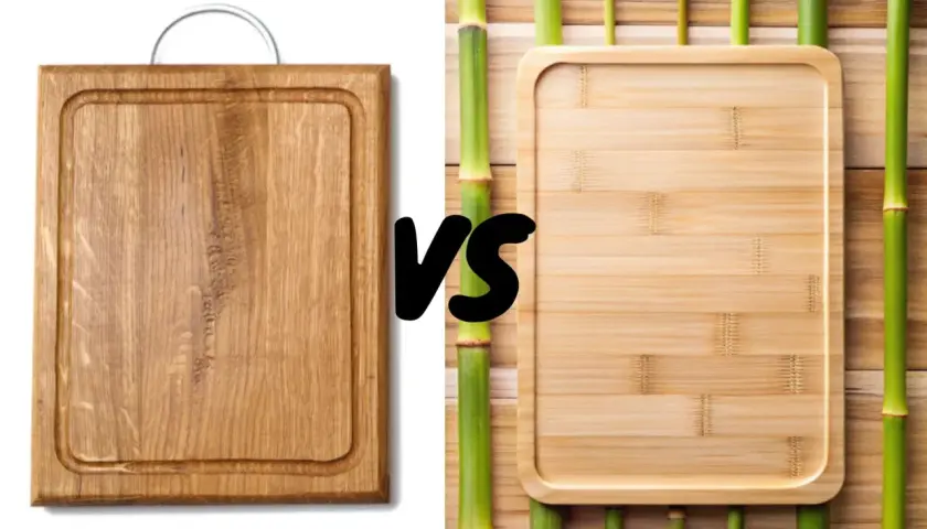 A sturdy acacia wood cutting board faces off against a sleek bamboo board, surrounded by vibrant green bamboo stalks.