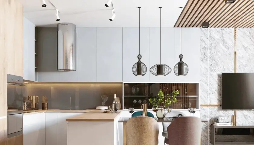 Cocina moderna con campana extractora plateada, lámparas colgantes de diseño y una mesa lista para cenar. La iluminación ambiental crea una atmósfera acogedora, con suficientes **lúmenes por m2** para cada actividad.