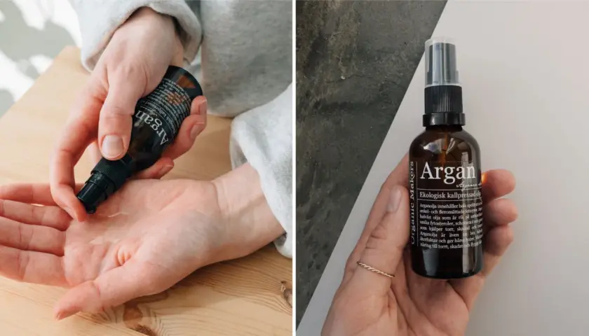 En hand applicerar arganolja för hudvård. Flaskan med ekologisk kallpressad arganolja syns också.
