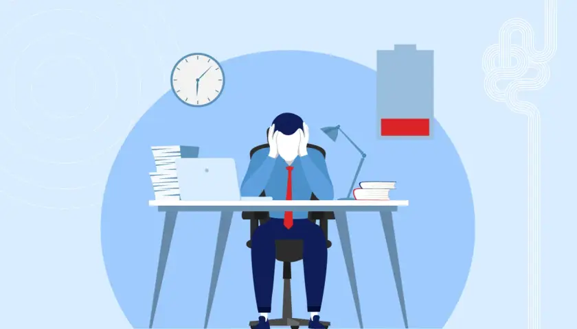 A stressed person at a desk with a low battery icon, symbolizing the need for a thriving mindset to overcome burnout.