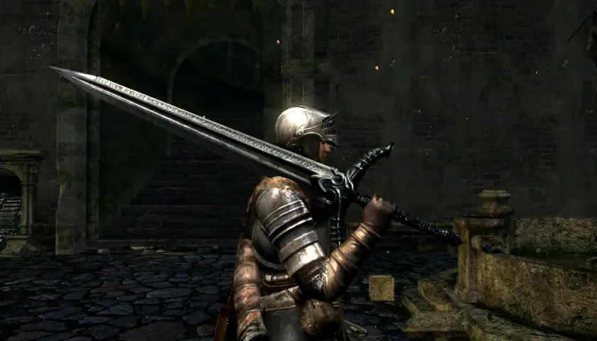 Rycerz w zbroi z wielkim mieczem, na którym widnieje napis "MAY YOUR FOES GET WRECKED FOREVER MORE FOR THE REAL DARK SOULS".