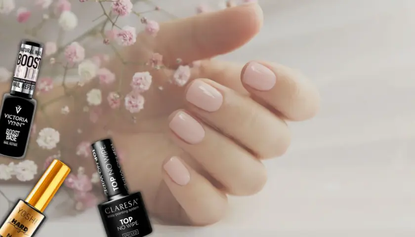 Delikatne, różowe paznokcie i buteleczki z produktami do stylizacji, w tym top do paznokci.