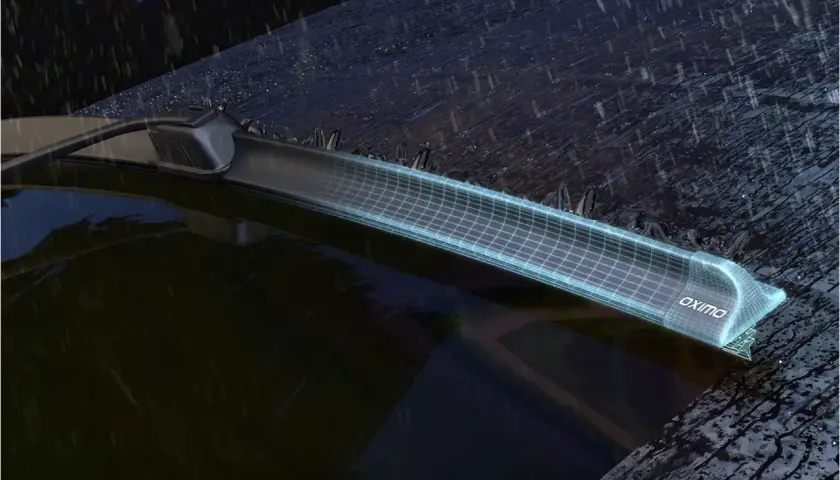 Nowoczesne wycieraczki samochodowe Oximo z siatką technologiczną, pokazujące różne typy mocowań wycieraczek w deszczu.