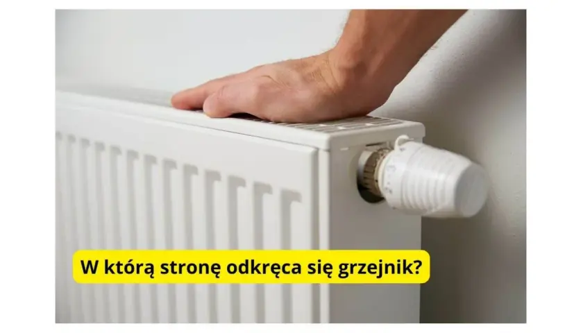 Dłoń na grzejniku, obok termostatu. Pytanie brzmi: w którą stronę się odkręca grzejnik, by było cieplej?