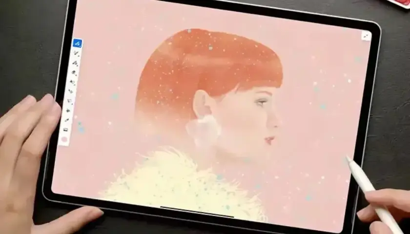 Tworzenie portretu kobiety z rudymi włosami w programie Adobe Fresco. Delikatne pociągnięcia pędzlem tworzą efekt akwareli.