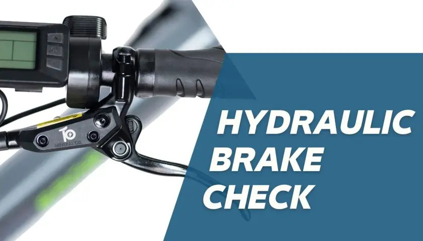 Close-up of an e-bike's hydraulic brake lever and display. Learn about old brake fluid symptoms and how to check your brakes.