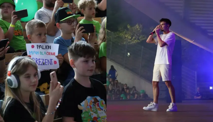 Dzieci na koncercie, jedno z nich trzyma transparent "PALION mam dla ciebie prezent". Na scenie artysta.