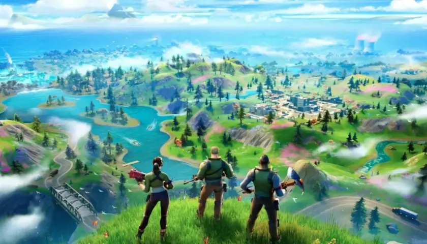 Trzech graczy Fortnite od ilu lat, obserwuje z góry kolorową wyspę z rzekami i miastem.