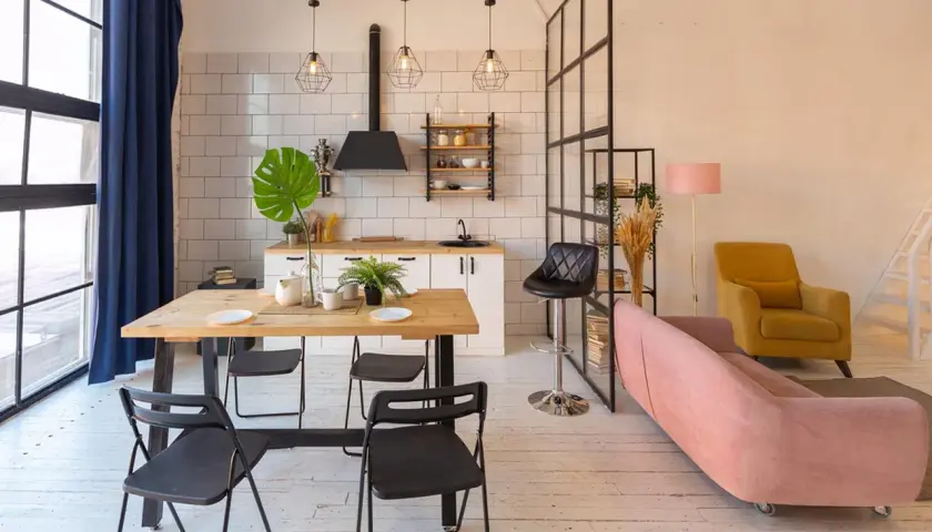 Stylowe mieszkanie studio z jadalnią, aneksem kuchennym i strefą wypoczynkową.