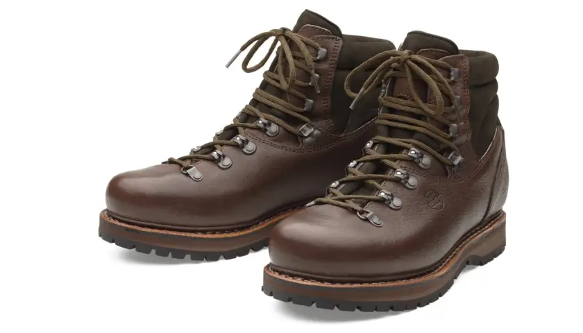 Brown leather hiking boots, crafted from durable yak leather, with sturdy soles and laces.