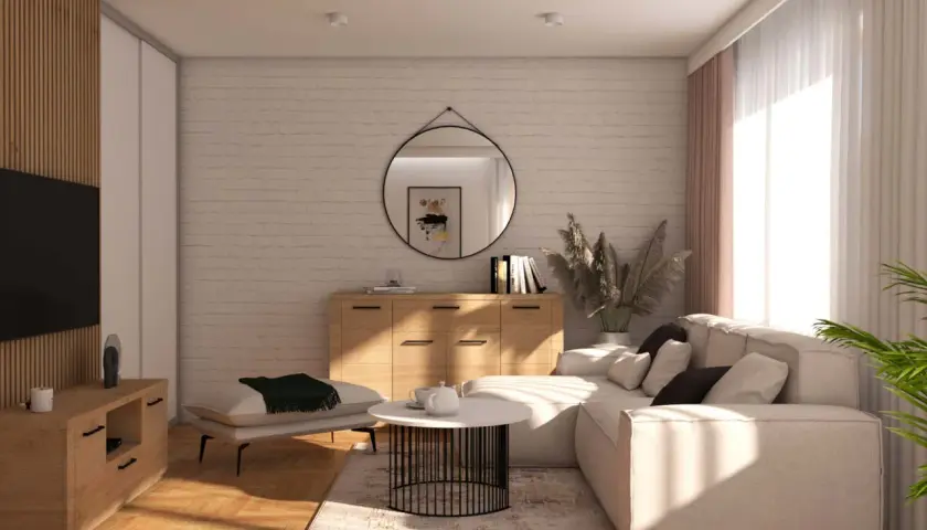Jasny salon z sofą, stolikiem kawowym i komodą. Drewniane akcenty i lustro podkreślają **minimalizm w domu**.