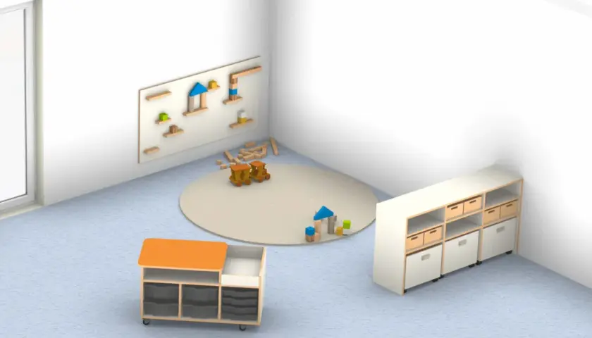 Kindergarten-Bauecke mit Holzbausteinen, Spielzeugzügen und Aufbewahrungsmöbeln.