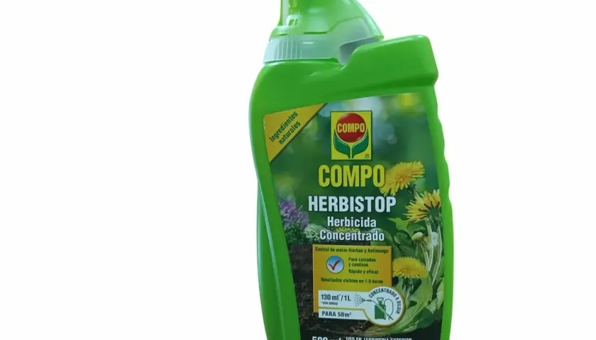 Bouteille verte de désherbant Compo Herbistop, à base d'acide pélargonique, pour un jardin sans mauvaises herbes.