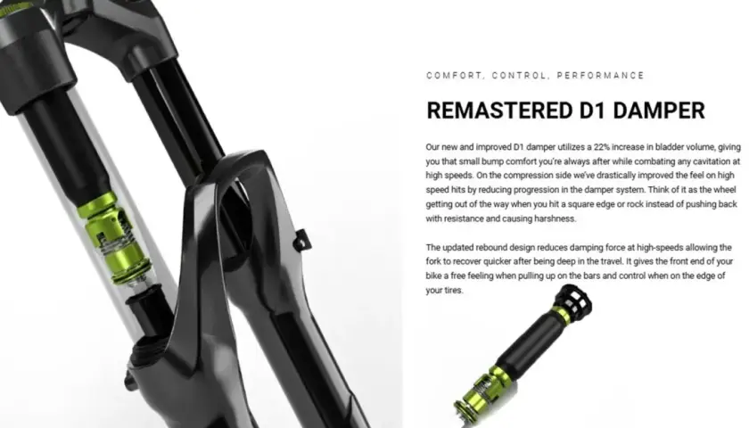 Close-up of a bicycle fork showing the internal D1 damper with green accents. This remastered D1 damper offers improved comfort and control.