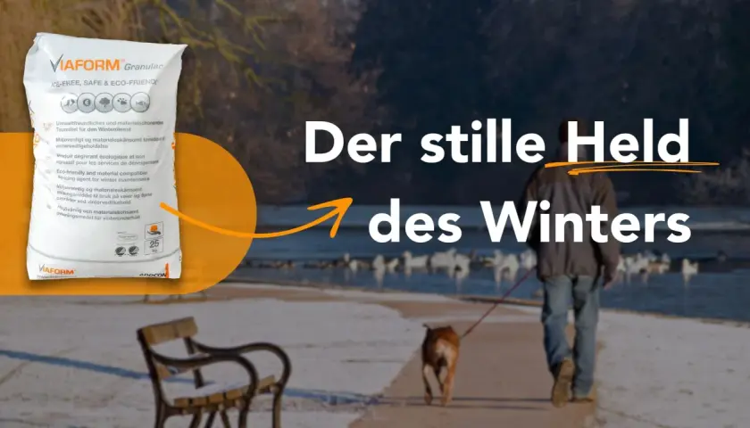 VIAFORM Granular: eine umweltfreundliche streusalz alternative für den Winterdienst. Ein Mann mit Hund spaziert am Wasser.