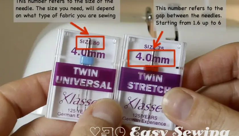 Hands hold twin needle packs, showing sizes 80 and 75. The gap between needles is also a key factor.