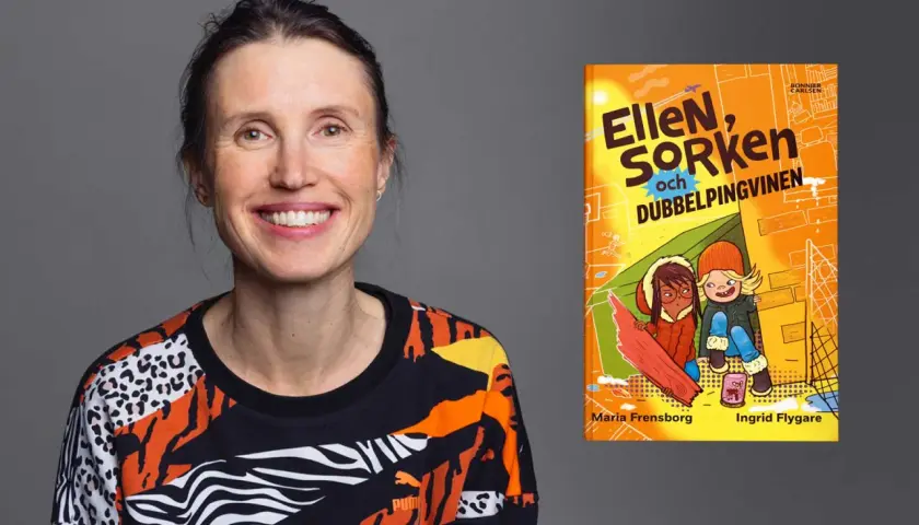 Maria Frensborg ler glatt bredvid boken "Ellen, Sorken och dubbelpingvinen".