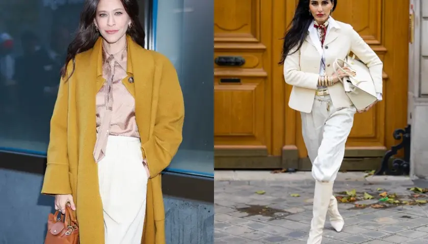 Dwie kobiety w eleganckich stylizacjach. Jedna w musztardowym płaszczu i białych spodniach zimą, druga w kremowym żakiecie i białych spodniach.