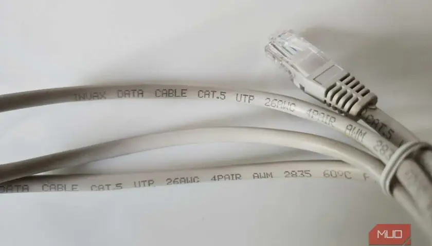 Two grey Cat.5 ethernet cables are shown, one with an RJ45 connector. The text on the cables indicates they are suitable for data transmission, with no mention of minimum ethernet cable length.