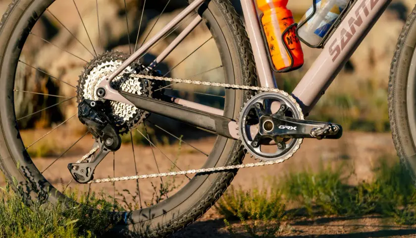 Close-up of a gravel bike's drivetrain, featuring Shimano GRX components. A detailed shimano grx review would highlight this robust gearing.