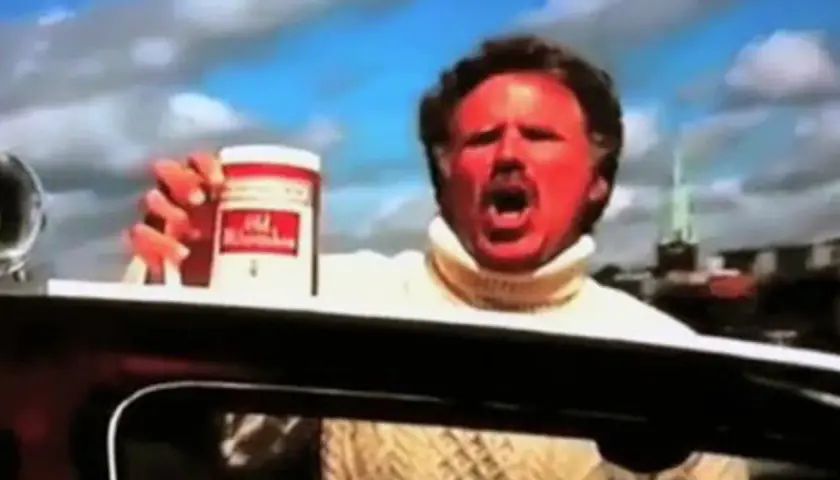 Will Ferrell med solbränd hy och vit polotröja håller upp en burk Old Spice.