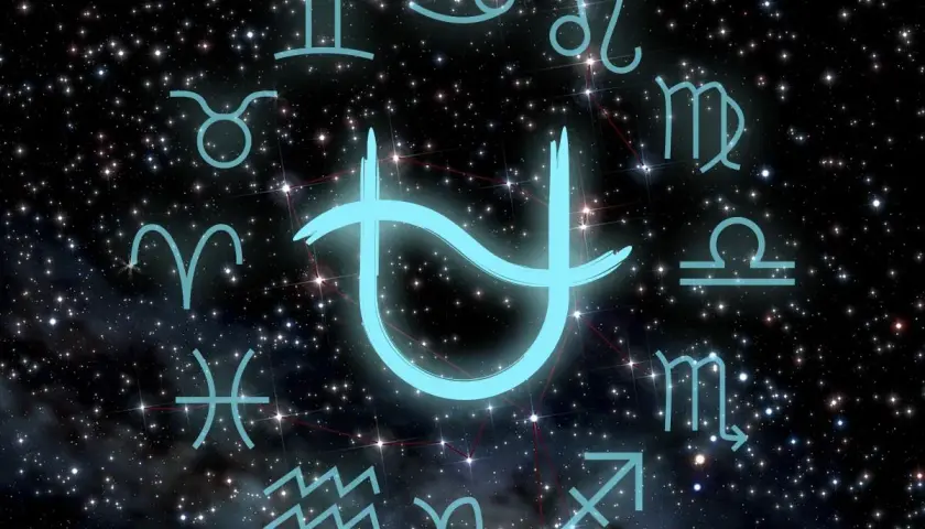 Jasnoniebieski symbol, być może nowy znak zodiaku, otoczony tradycyjnymi symbolami zodiaku na tle rozgwieżdżonego nieba.