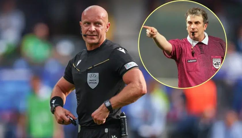Sędzia piłkarski w czarnym stroju z emblematem UEFA i w okręgu sędzia w różowej koszulce z logo Adidasa i FIFA.