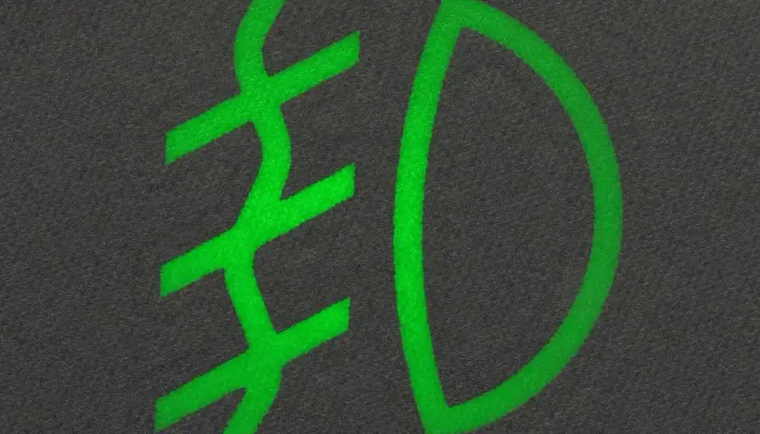 Zielony symbol przeciwmgielny na ciemnym tle.