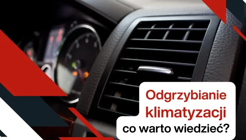 Widok na kratkę nawiewu klimatyzacji samochodowej i fragment deski rozdzielczej.